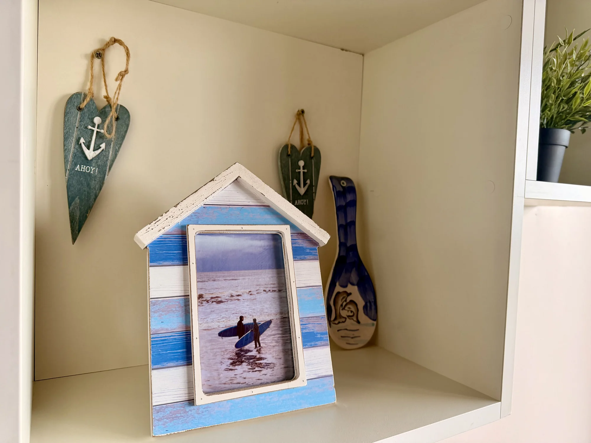 Coastal decorations and framed photograph at Dolphin House