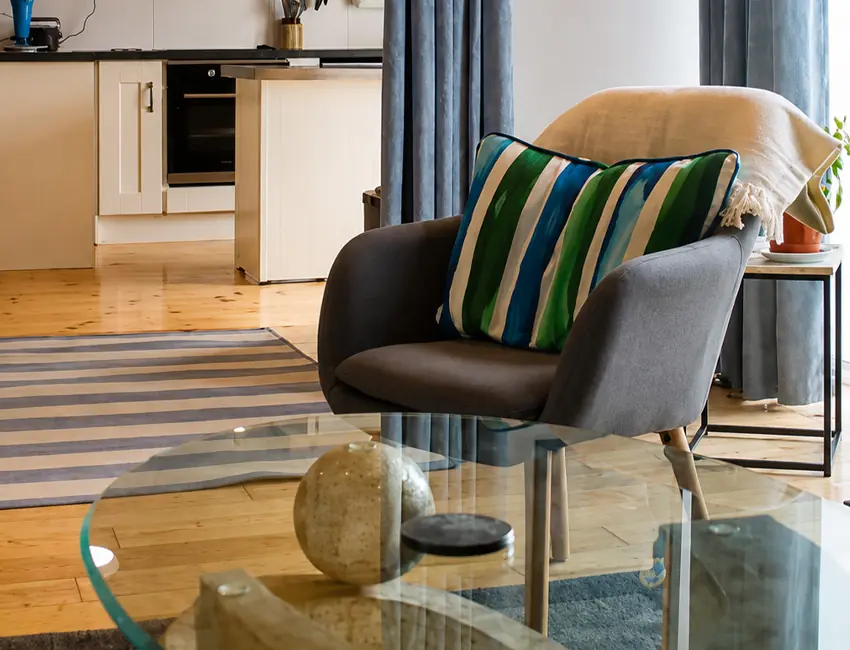 Armchair in the open-plan living area at Sailor’s Cabin