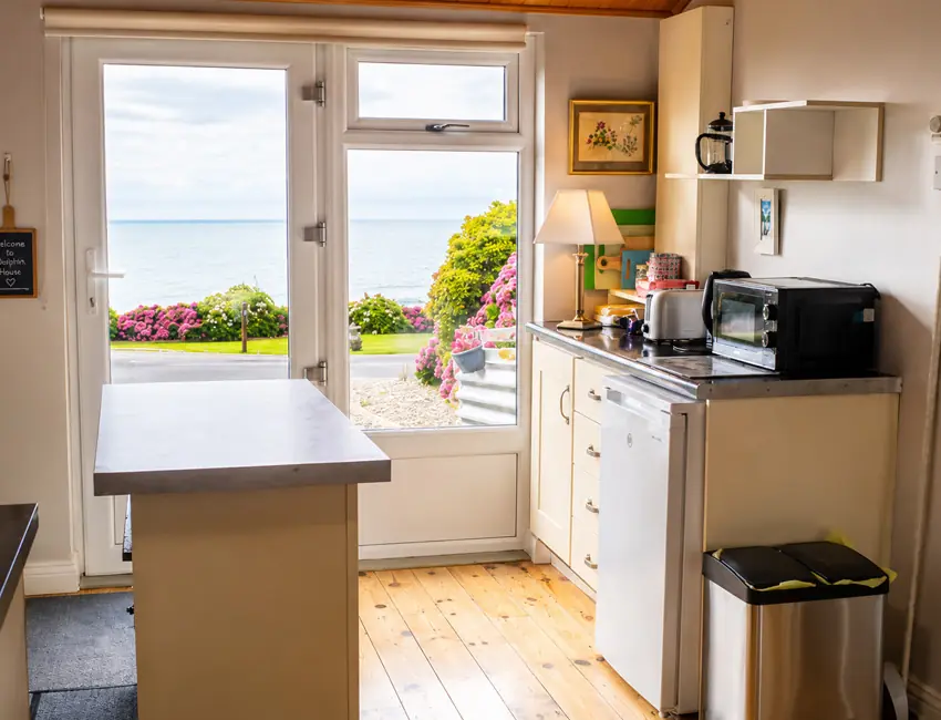 Kitchen looking onto the private terrace at Sailor’s Cabin