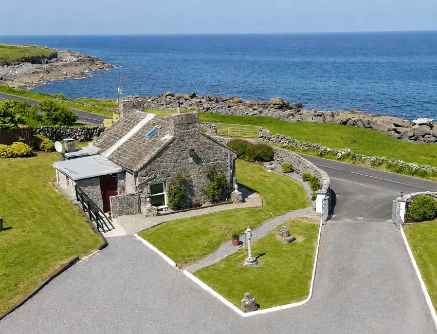Seascape Cottage and its garden beside the Atlantic shore