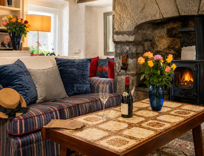 Cosy fireside living room at Seascape Cottage