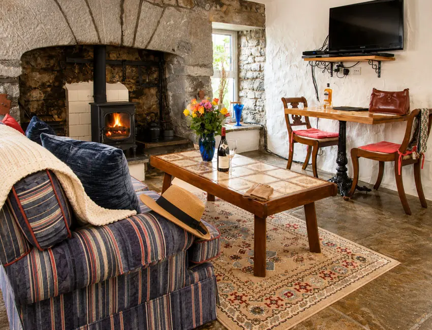 Traditional fireplace and dining area at Seascape Cottage