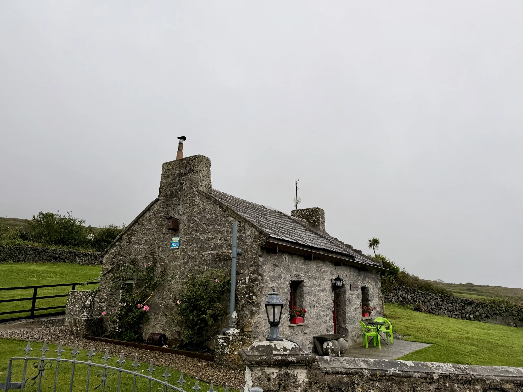 Stone exterior of Seascape Cottage viewed from the garden wall